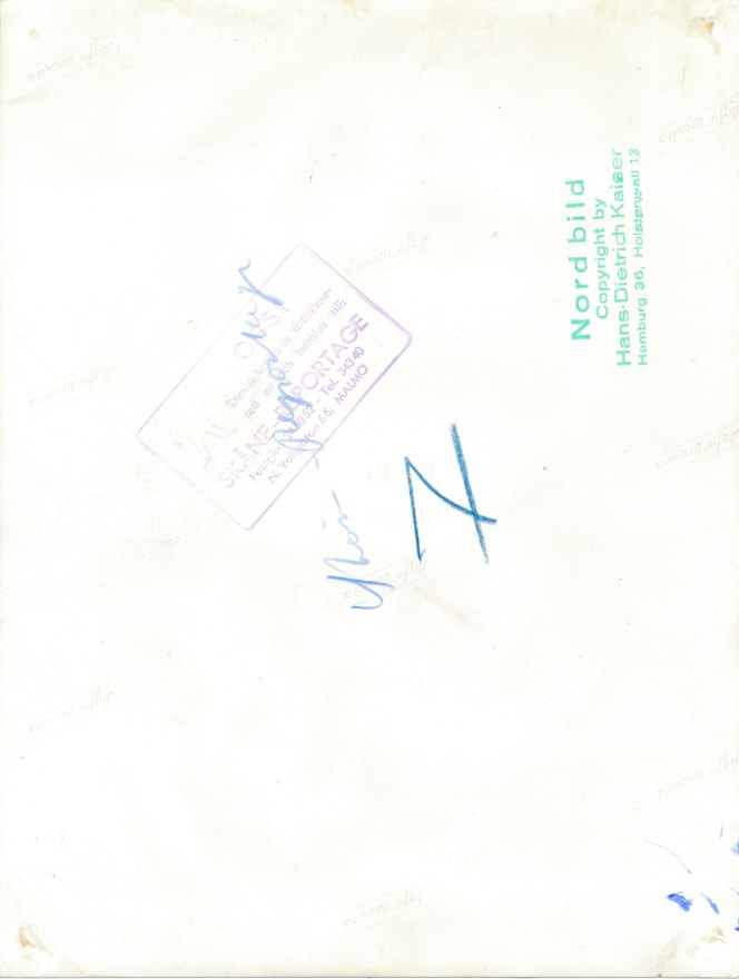 18b77